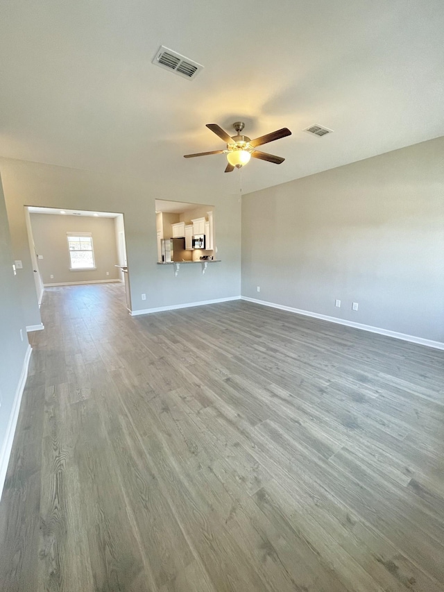 404 Wren Way, Spring Hill, TN 37174 - unfurnished living room with ceiling fan and wood finished floors