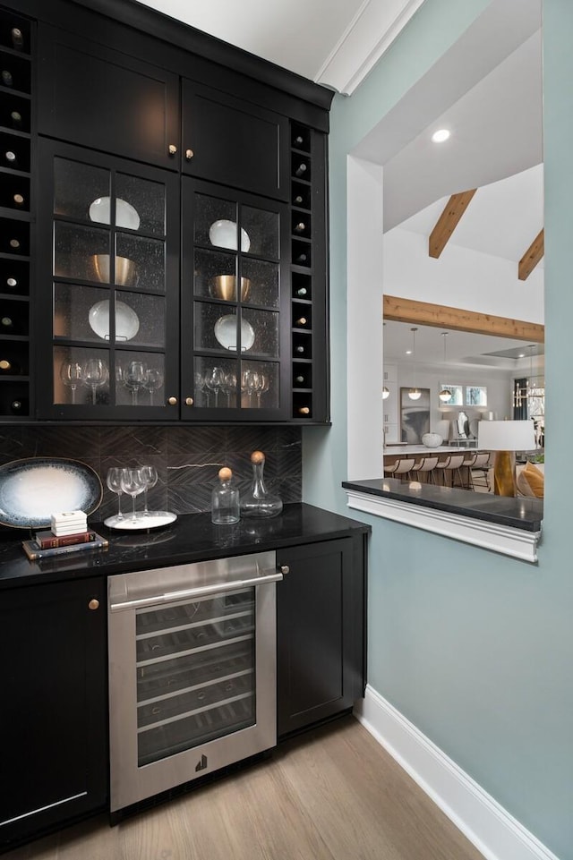 7258 Murrel Dr, Franklin, TN 37064 - indoor dry bar with wine cooler, light wood finished floors, and beamed ceiling