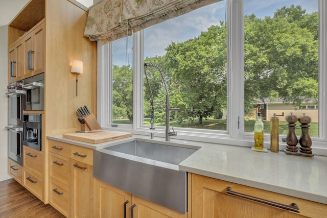 111 Hardingwoods Pl, Nashville, TN 37205 - kitchen with light countertops, stainless steel double oven, healthy amount of natural light, and wood finished floors
