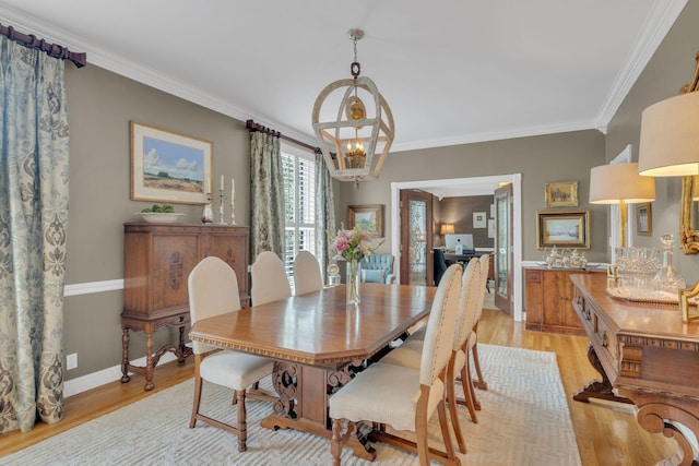 111 Hardingwoods Pl, Nashville, TN 37205 - dining room featuring light wood-type flooring, crown molding, and a chandelier