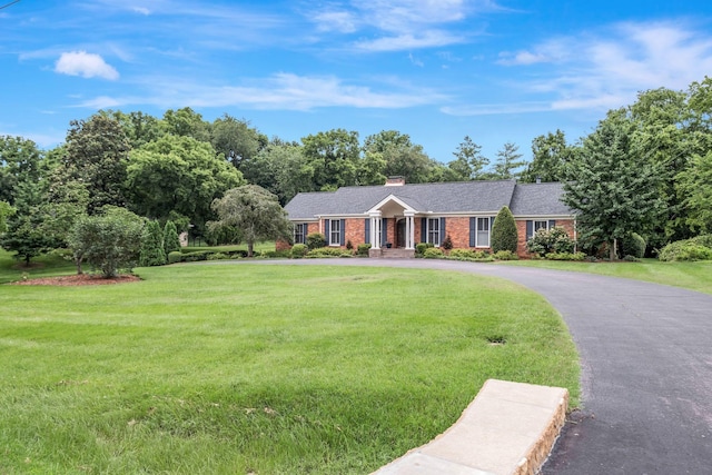 111 Hardingwoods Pl, Nashville, TN 37205 - ranch-style home with a front yard, brick siding, driveway, and a chimney