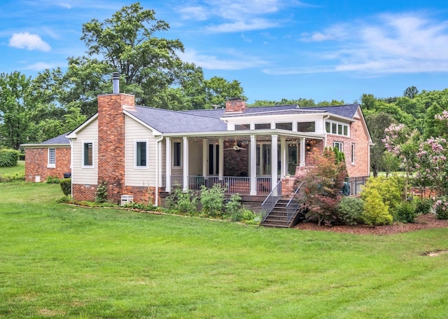 111 Hardingwoods Pl, Nashville, TN 37205 - back of property featuring a chimney, a yard, a ceiling fan, and brick siding