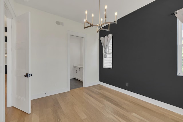 5735 Willoughby Way, Murfreesboro, TN 37129 - unfurnished room with light wood-type flooring and a chandelier