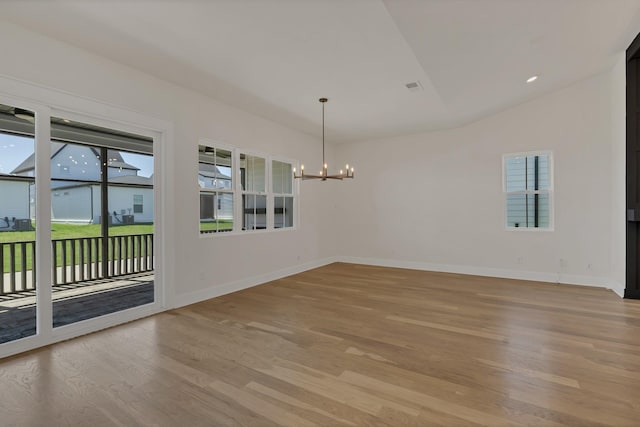 5735 Willoughby Way, Murfreesboro, TN 37129 - spare room with a chandelier, light wood finished floors, and lofted ceiling