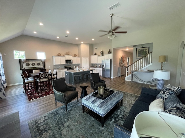 423 Wren Way, Spring Hill, TN 37174 - living area featuring dark wood-type flooring, a ceiling fan, vaulted ceiling, stairway, and recessed lighting