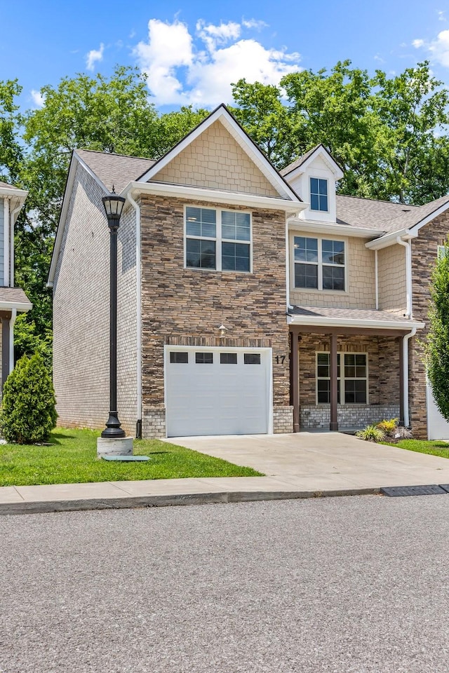 3319 Old Hickory Blvd Unit 17, Old Hickory, TN 37138 - view of front of house featuring driveway, an attached garage, stone siding, and roof with shingles