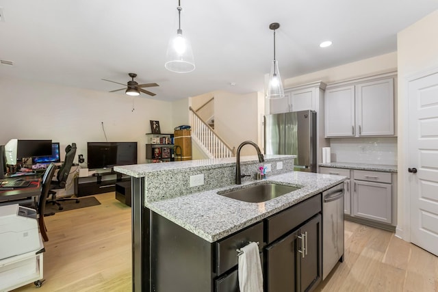 3319 Old Hickory Blvd Unit 17, Old Hickory, TN 37138 - kitchen with appliances with stainless steel finishes, light wood-style floors, a ceiling fan, a kitchen island with sink, and recessed lighting