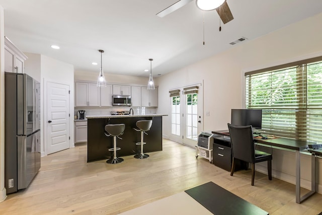3319 Old Hickory Blvd Unit 17, Old Hickory, TN 37138 - kitchen with appliances with stainless steel finishes, light wood-style flooring, an office area, a ceiling fan, and light countertops