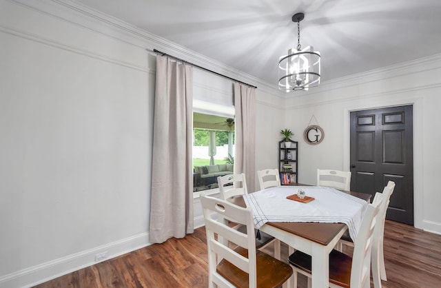 723 Alecia Page Cv, Humboldt, TN 38343 - dining space with a chandelier, dark wood-style flooring, and ornamental molding