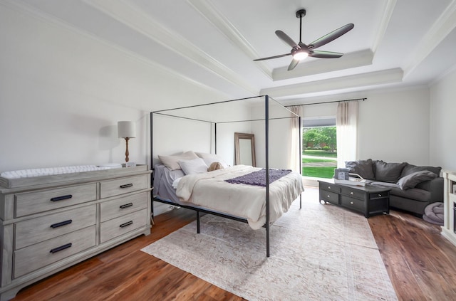 723 Alecia Page Cv, Humboldt, TN 38343 - bedroom featuring dark wood finished floors, ornamental molding, a tray ceiling, and ceiling fan