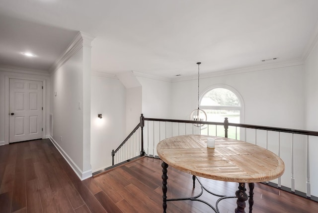 723 Alecia Page Cv, Humboldt, TN 38343 - corridor featuring wood finished floors, an upstairs landing, ornamental molding, and a chandelier
