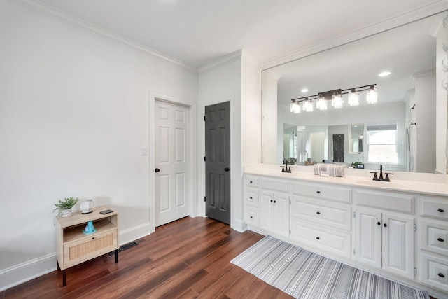 723 Alecia Page Cv, Humboldt, TN 38343 - full bathroom featuring double vanity, wood finished floors, and ornamental molding