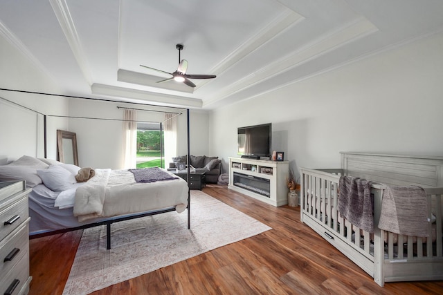 723 Alecia Page Cv, Humboldt, TN 38343 - bedroom with a raised ceiling, ornamental molding, wood finished floors, and a ceiling fan