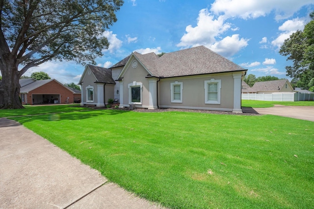 723 Alecia Page Cv, Humboldt, TN 38343 - traditional home with stucco siding and a shingled roof