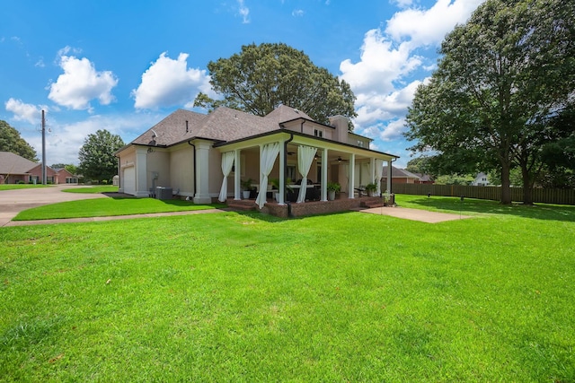 723 Alecia Page Cv, Humboldt, TN 38343 - view of front of house featuring roof with shingles, an attached garage, driveway, and ceiling fan