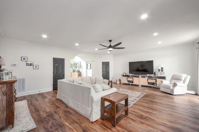723 Alecia Page Cv, Humboldt, TN 38343 - living room featuring arched walkways, ornamental molding, ceiling fan, recessed lighting, and wood finished floors