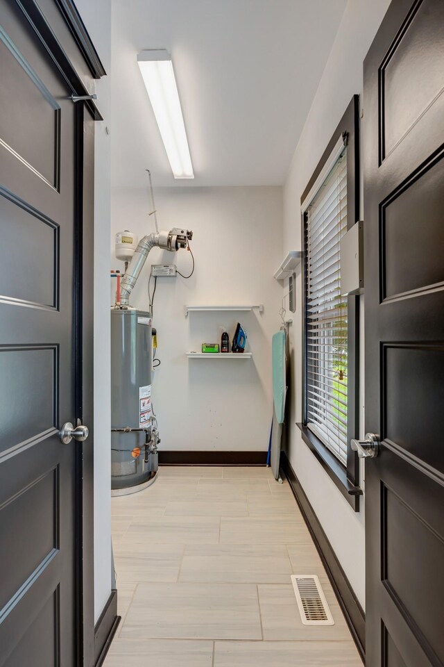 2136 Buena Vista Pike Unit B, Nashville, TN 37218 - washroom with gas water heater and baseboards