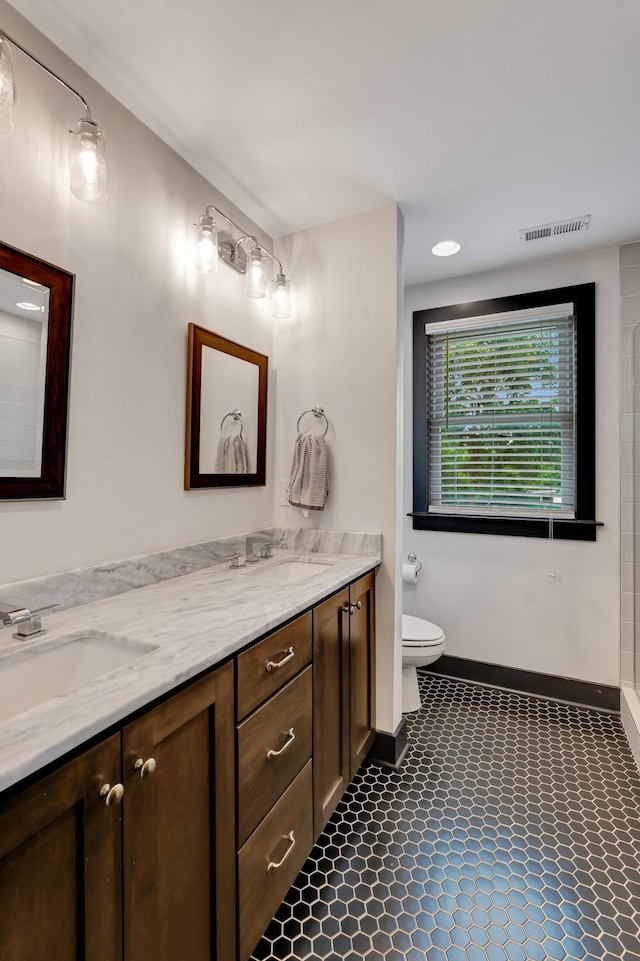 2136 Buena Vista Pike Unit B, Nashville, TN 37218 - full bathroom featuring double vanity, recessed lighting, and a shower