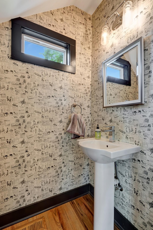 2136 Buena Vista Pike Unit B, Nashville, TN 37218 - bathroom featuring vaulted ceiling and wood finished floors