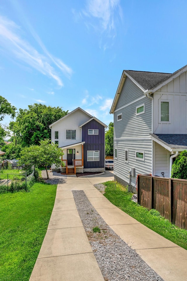 2136 Buena Vista Pike Unit B, Nashville, TN 37218 - view of front of property with board and batten siding, a porch, and roof with shingles