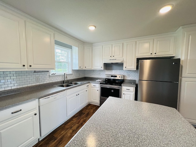 4977 Little Dry Creek Rd, Pulaski, TN 38478 - kitchen with appliances with stainless steel finishes, under cabinet range hood, dark wood-type flooring, white cabinetry, and recessed lighting