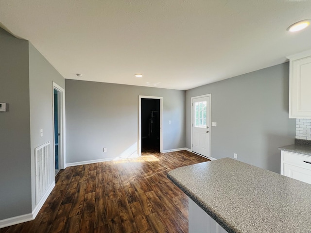 4977 Little Dry Creek Rd, Pulaski, TN 38478 - kitchen featuring dark wood-style flooring, white cabinets, recessed lighting, decorative backsplash, and open floor plan