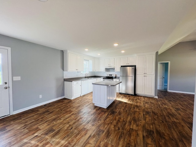 4977 Little Dry Creek Rd, Pulaski, TN 38478 - kitchen with stainless steel appliances, dark wood-style flooring, a center island, white cabinetry, and tasteful backsplash