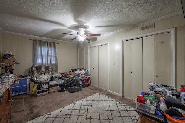 10 Pinecrest Dr, Jackson, TN 38301 - bedroom featuring carpet floors, multiple closets, ornamental molding, a ceiling fan, and a textured ceiling