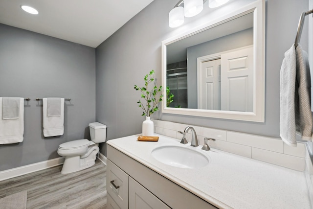 438 Siena Dr, Nashville, TN 37205 - full bathroom featuring vanity, wood finished floors, and a shower with door