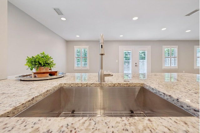 438 Siena Dr, Nashville, TN 37205 - kitchen view of light stone counters, recessed lighting, and french doors