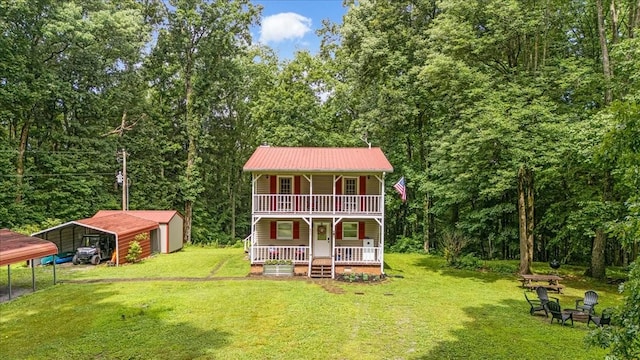 802 Evans Rd, Winchester, TN 37398 - back of property with a porch, a lawn, a carport, and a metal roof