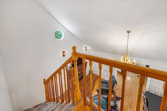 802 Evans Rd, Winchester, TN 37398 - staircase with a chandelier, wood finished floors, and vaulted ceiling
