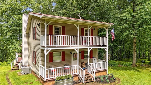 802 Evans Rd, Winchester, TN 37398 - view of front of home featuring covered porch, a balcony, a front yard, and stairs