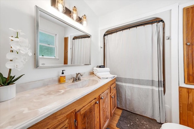 802 Evans Rd, Winchester, TN 37398 - bathroom with vanity, wood finished floors, and a shower with shower curtain