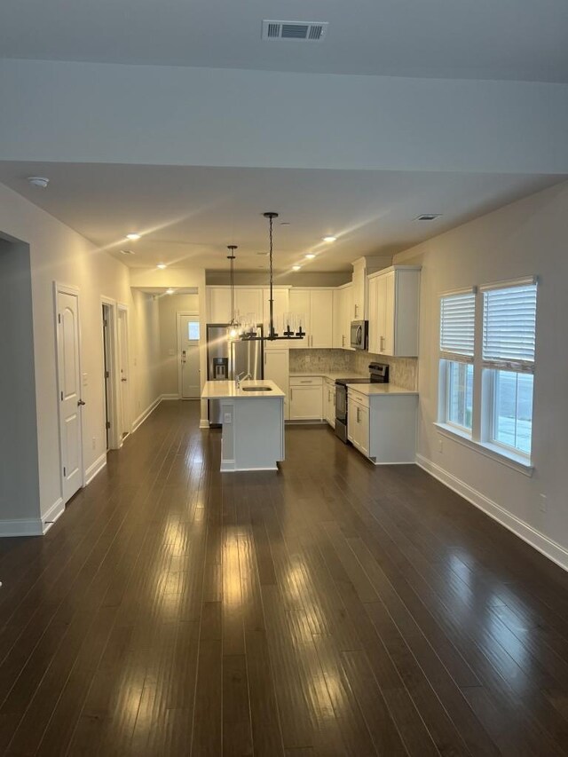 204 Douglas Bend Rd Unit 804, Gallatin, TN 37066 - unfurnished living room with recessed lighting and dark wood-style flooring