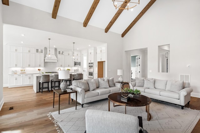 7262 Murrel Dr, Franklin, TN 37064 - living room featuring high vaulted ceiling, light wood-style flooring, recessed lighting, beam ceiling, and a chandelier