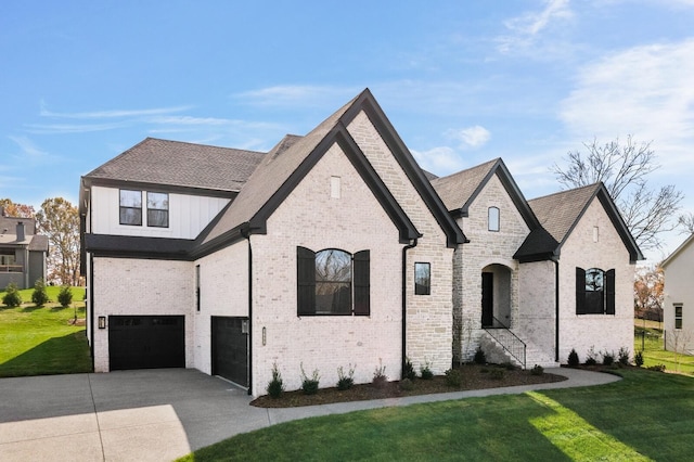 7262 Murrel Dr, Franklin, TN 37064 - french provincial home featuring driveway, a garage, a front yard, brick siding, and a shingled roof