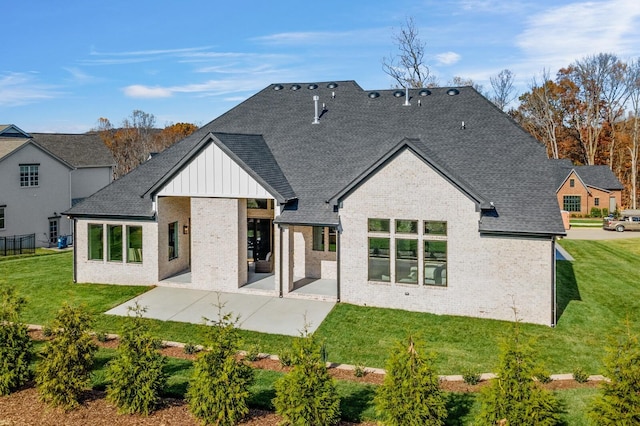 7262 Murrel Dr, Franklin, TN 37064 - back of property featuring brick siding, a patio area, board and batten siding, a lawn, and roof with shingles
