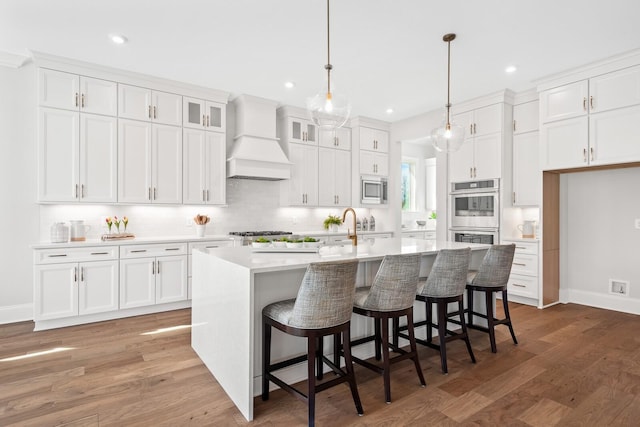 7262 Murrel Dr, Franklin, TN 37064 - kitchen featuring premium range hood, appliances with stainless steel finishes, white cabinets, and recessed lighting