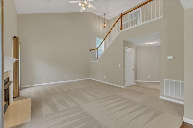 3133 Winberry Dr, Franklin, TN 37064 - unfurnished living room featuring carpet, a ceiling fan, vaulted ceiling, and a fireplace with flush hearth