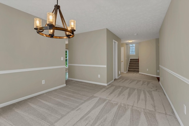 3133 Winberry Dr, Franklin, TN 37064 - carpeted empty room with a chandelier, stairway, and a textured ceiling