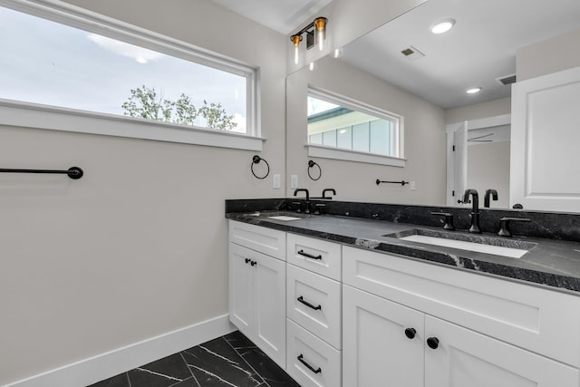 333 Isbill Rd, Chattanooga, TN 37419 - full bathroom featuring double vanity, marble look tiles, and recessed lighting