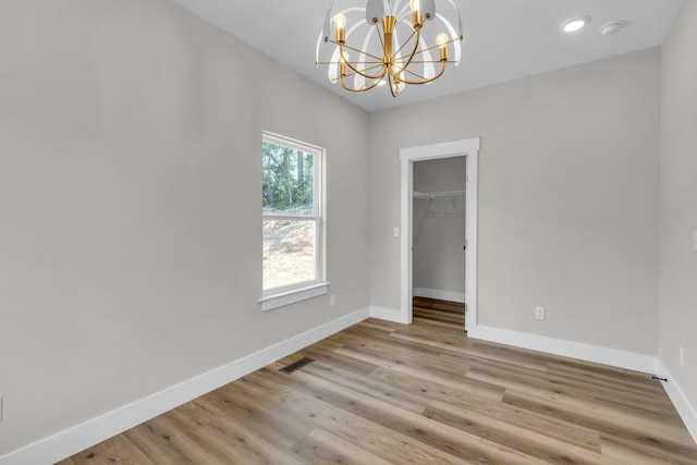 333 Isbill Rd, Chattanooga, TN 37419 - empty room featuring a smoke detector, a chandelier, and light wood-type flooring