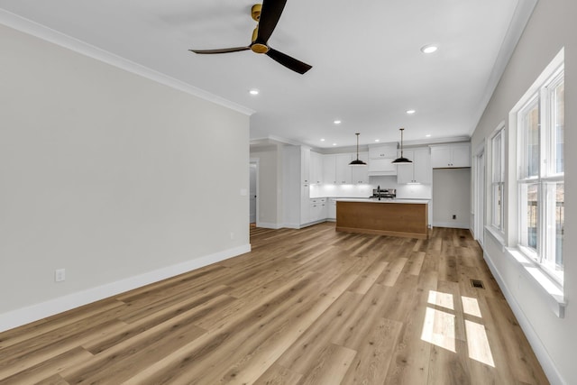 333 Isbill Rd, Chattanooga, TN 37419 - unfurnished living room with crown molding, ceiling fan, recessed lighting, and light wood-style floors