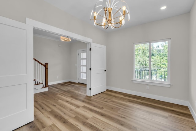 333 Isbill Rd, Chattanooga, TN 37419 - unfurnished room featuring a chandelier, stairs, light wood-style flooring, and recessed lighting
