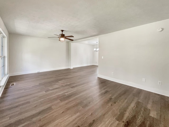 7203 Chester Rd, Fairview, TN 37062 - spare room featuring wood finished floors, ceiling fan, a chandelier, and a textured ceiling