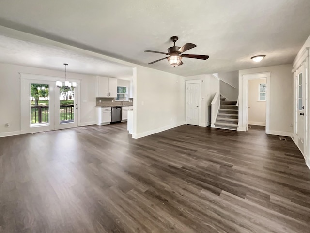 7203 Chester Rd, Fairview, TN 37062 - unfurnished living room with stairway, dark wood-type flooring, a ceiling fan, and a chandelier