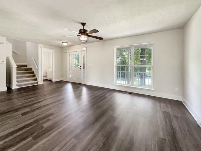 7203 Chester Rd, Fairview, TN 37062 - unfurnished living room with a ceiling fan, stairs, and dark wood finished floors