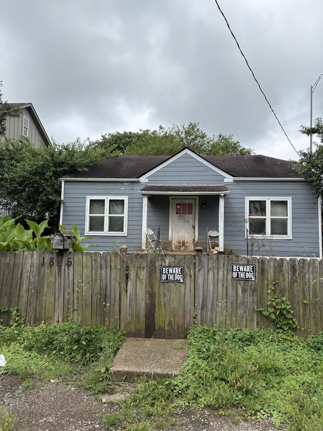 1815 7th Ave N, Nashville, TN 37208 - view of front of property with a fenced front yard and a shingled roof