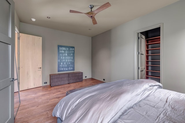 8005 Backwoods Dr, College Grove, TN 37046 - bedroom with wood finished floors, a walk in closet, and a ceiling fan
